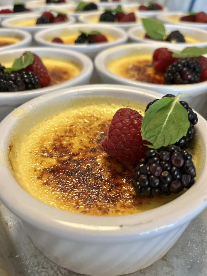 A tempting white dish featuring a medley of fresh berries and a creamy delight. The perfect complement to savor with a bowl of French Onion Soup